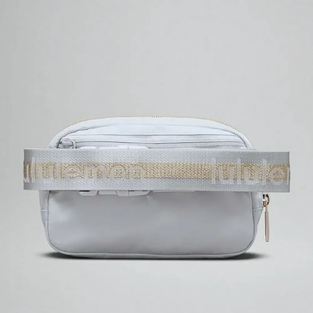 NEW Lululemon Everywhere Crossbody Belt Bag 1L Wordmark - Gray Silver and Gold